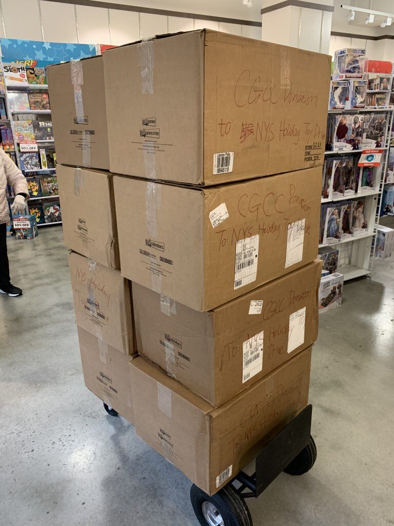 A stack of boxes in a store</p>
<p>Description automatically generated with medium confidence